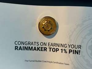 Certificate reading Congrats on earning your Rainmaker Top 1 percent pin, with the gold pin attached