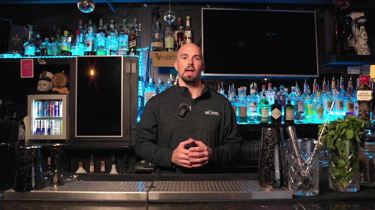 Behind the bar at The Bar School, answering whether the course is a license