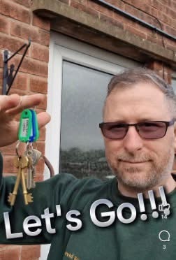 Man celebrating with property keys