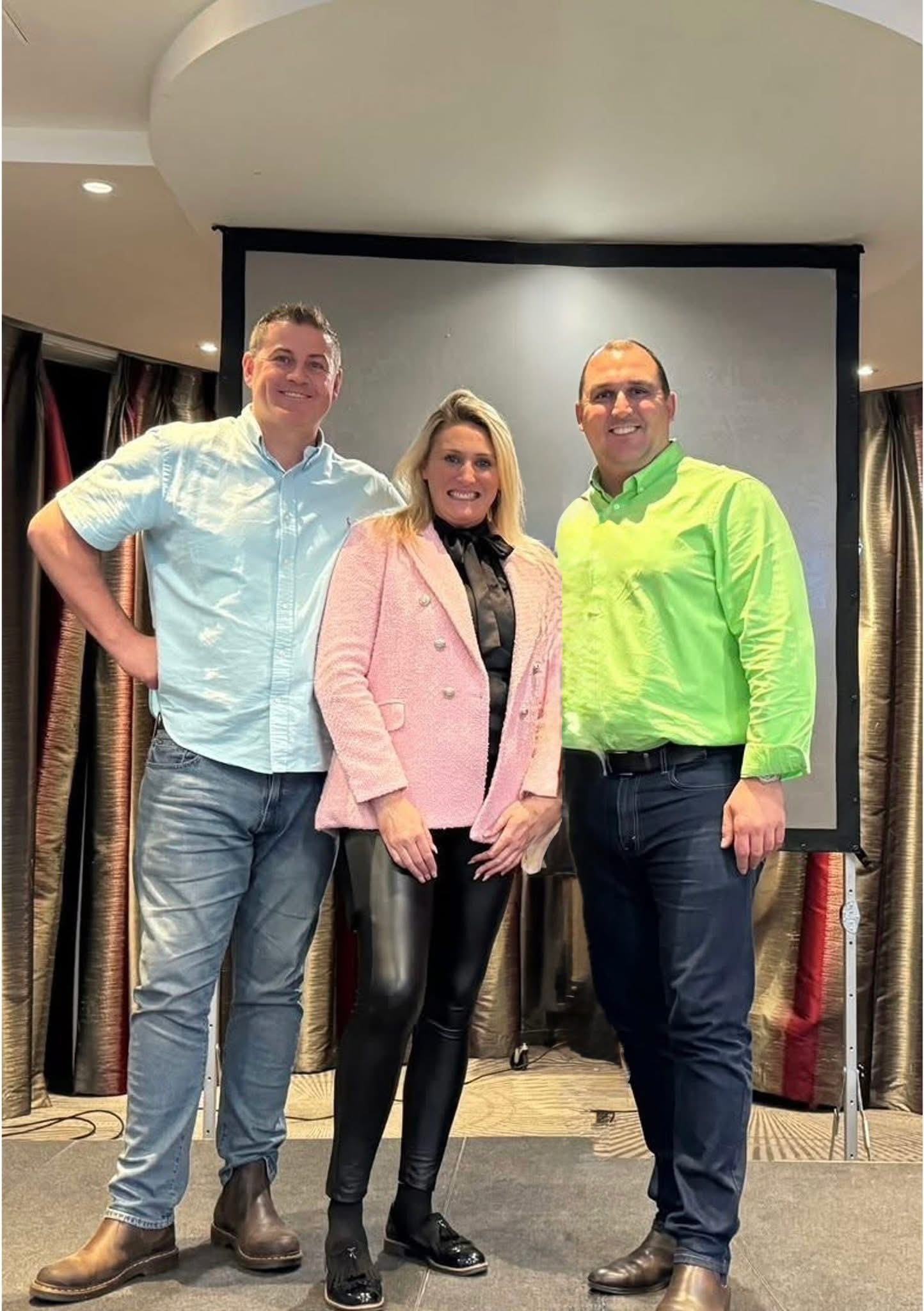 Three property specialists together at a training event