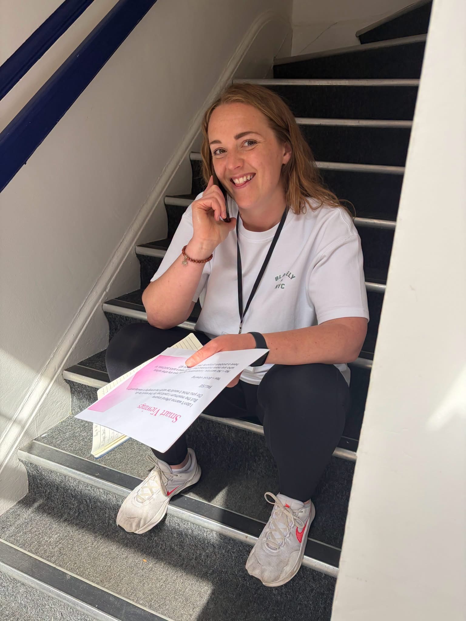 Delegate making a phone call with notes