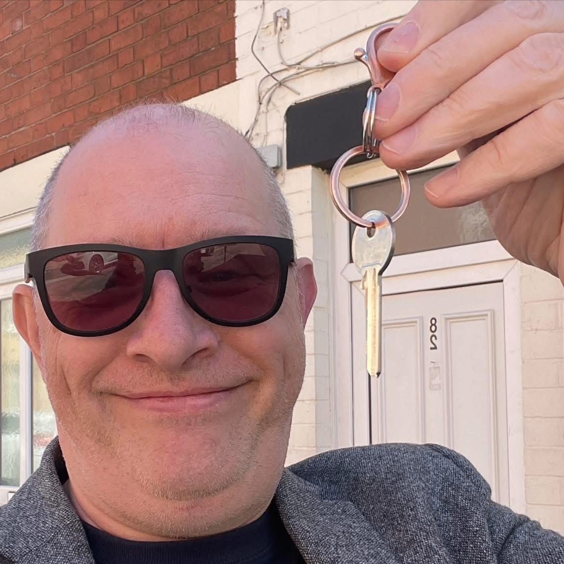 Man holding a property key