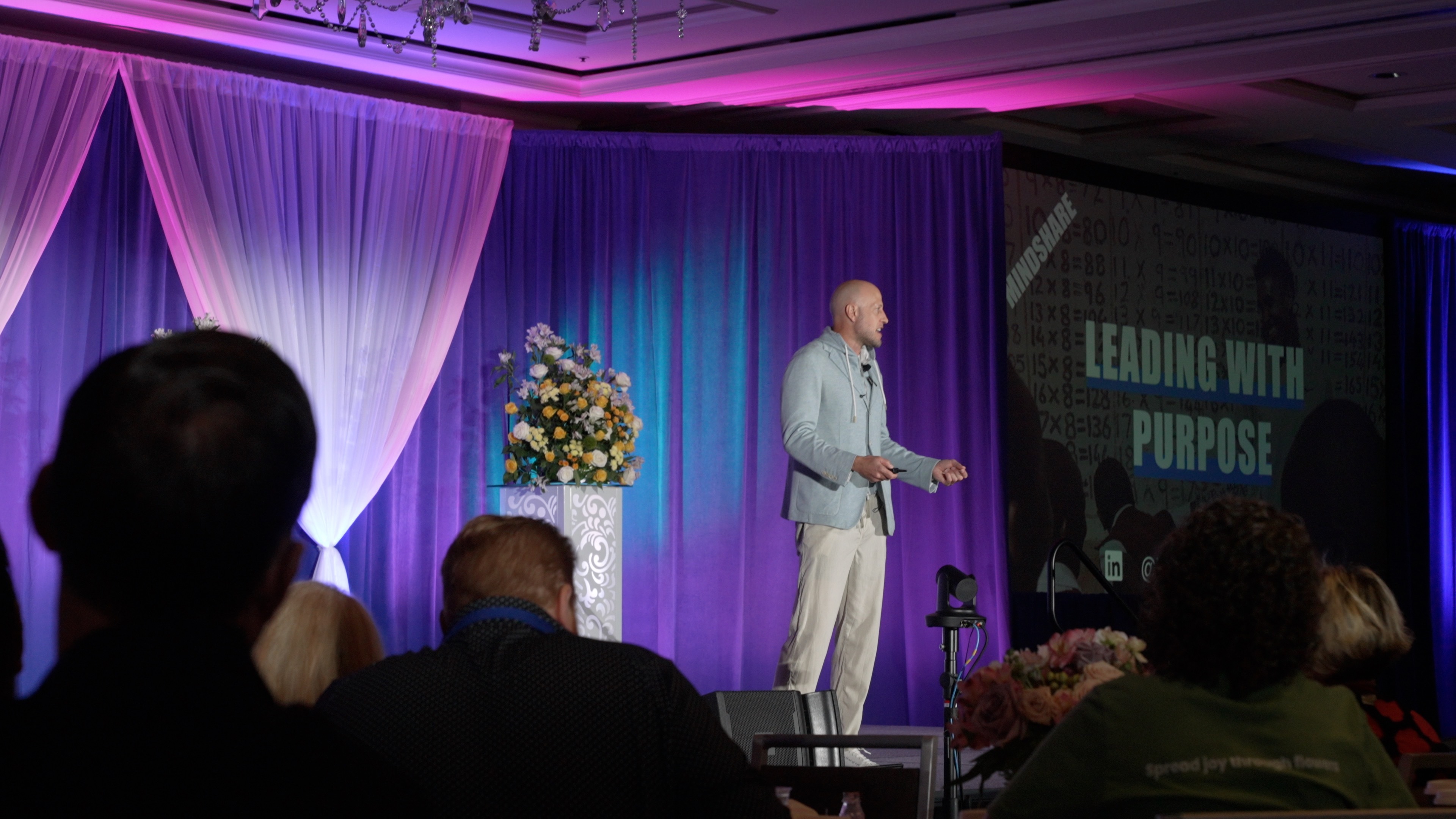 Mike Lee delivering a leadership keynote on stage