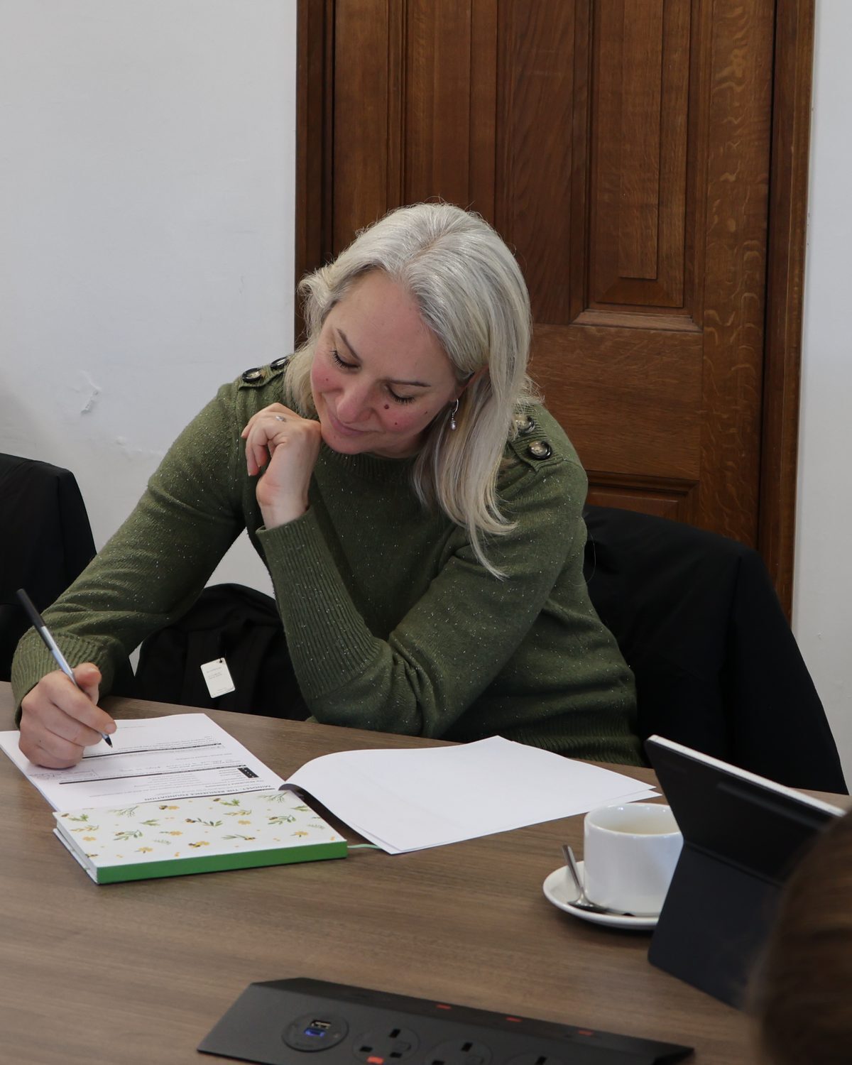 A delegate working through her sales notes at an Urban Spark workshop
