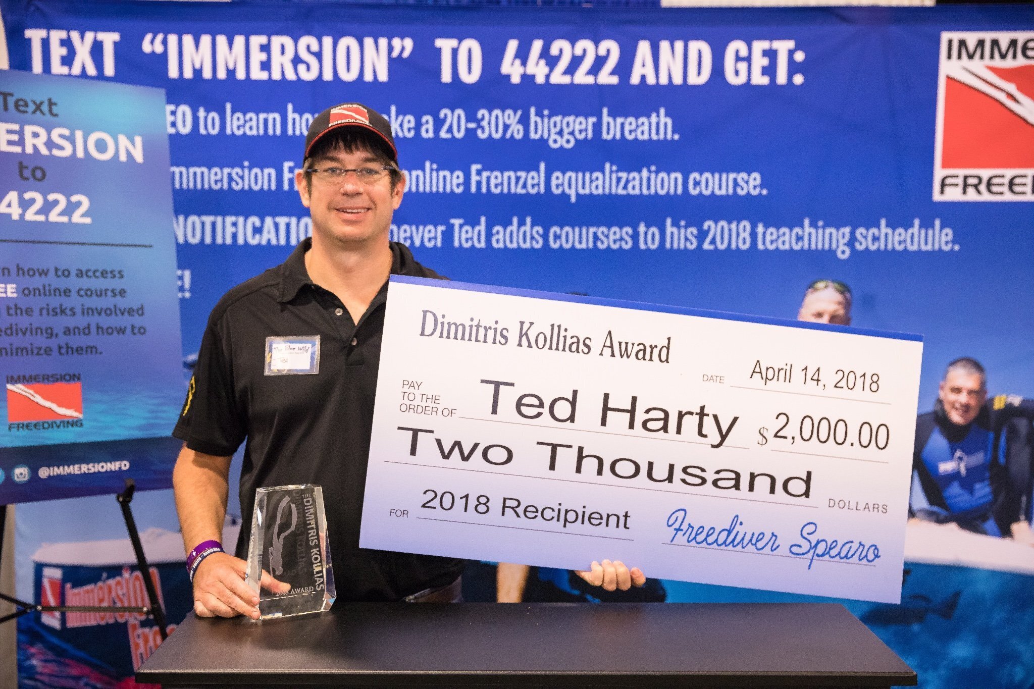 Ted Harty receiving the 2018 Dimitris Kollias Award at the Blue Wild trade show