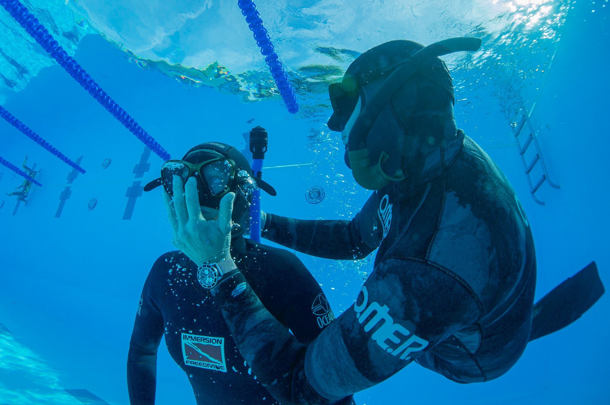 Freediver performing an in-water blackout rescue during training