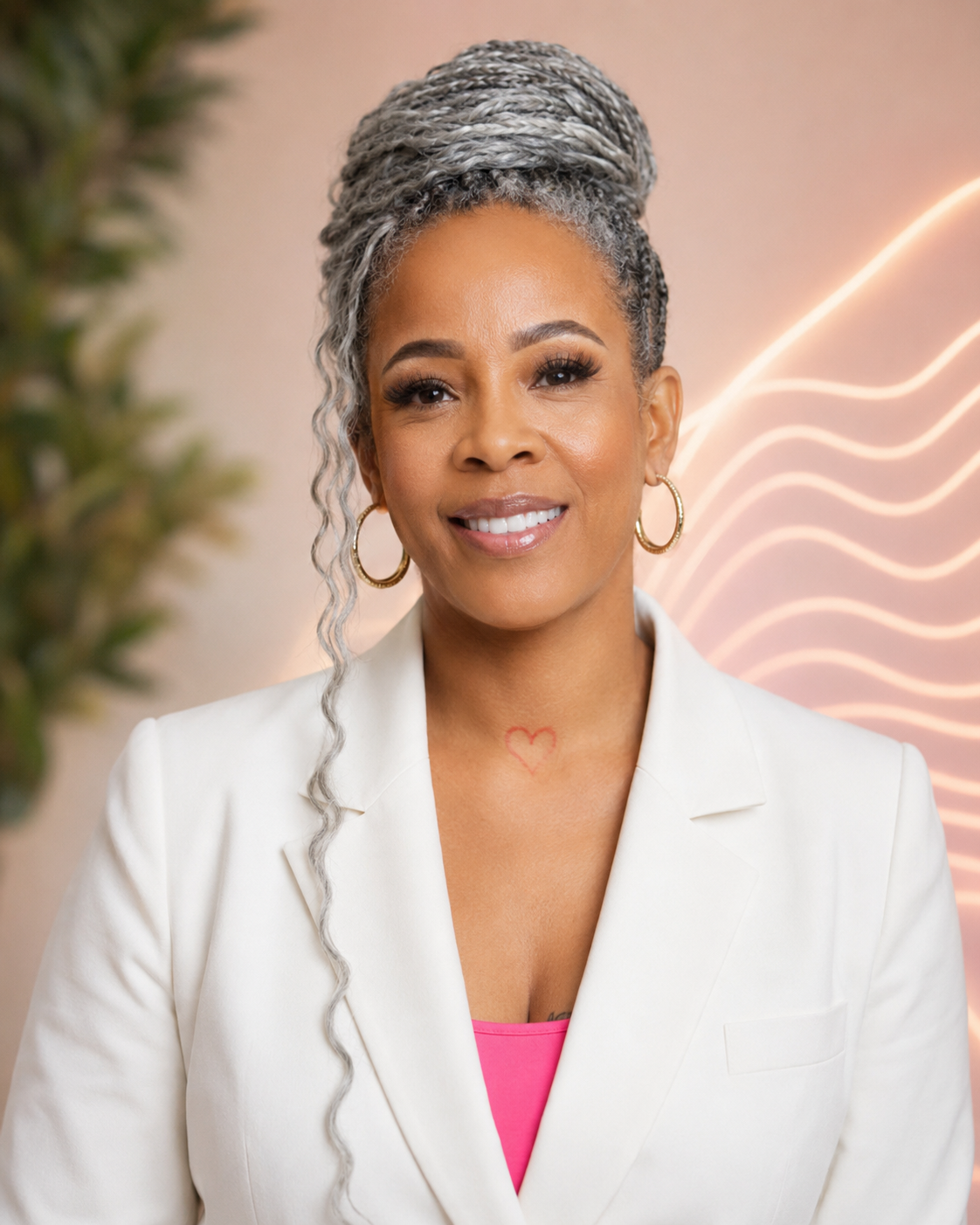 Lovette Knowlden, smiling, in a cream blazer